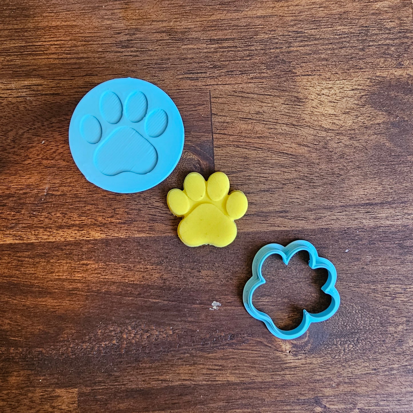 product image of a detailed paw print embosser and cutter, great for animal-themed cookies.